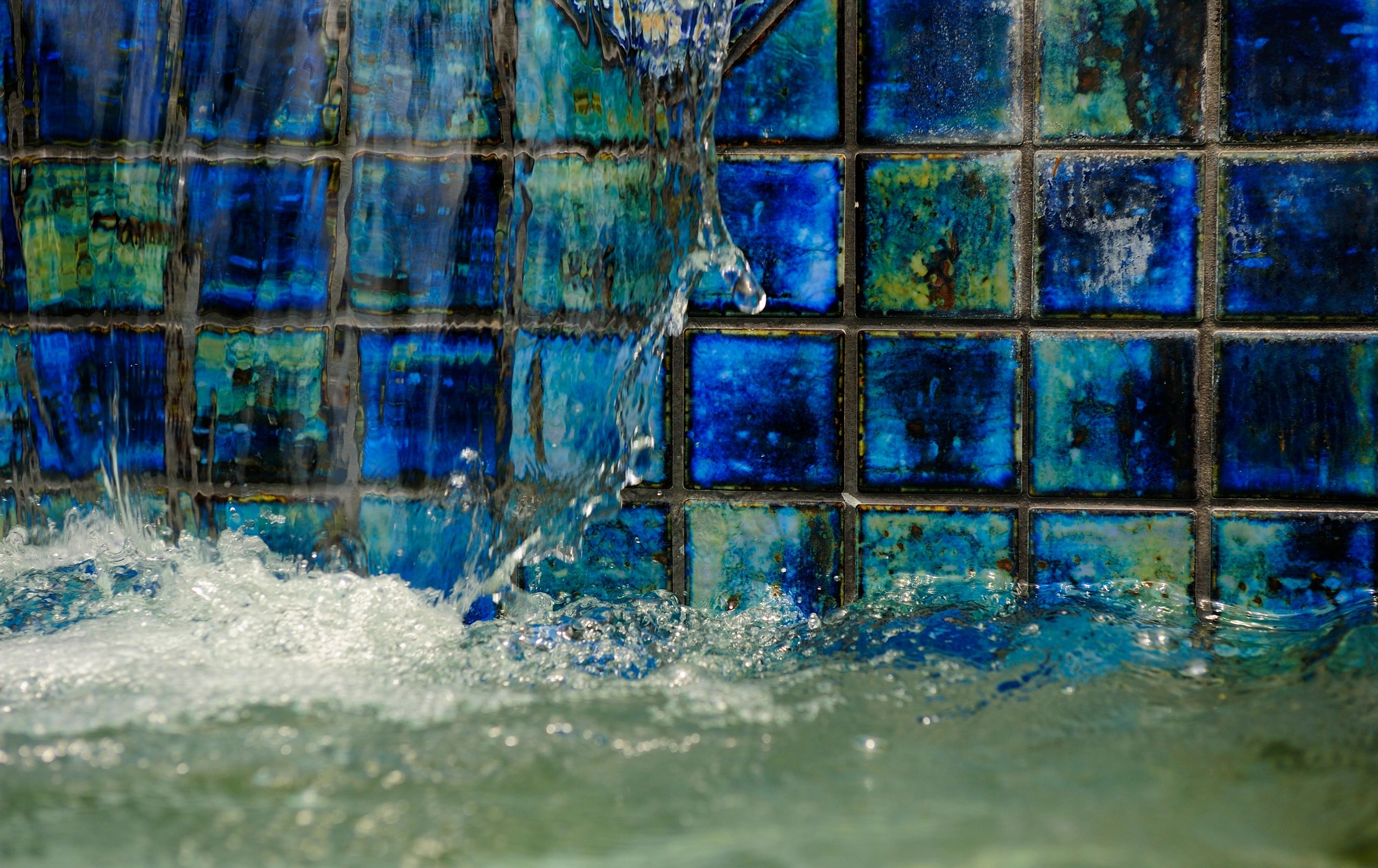 Glazed tile fountain with flowing water